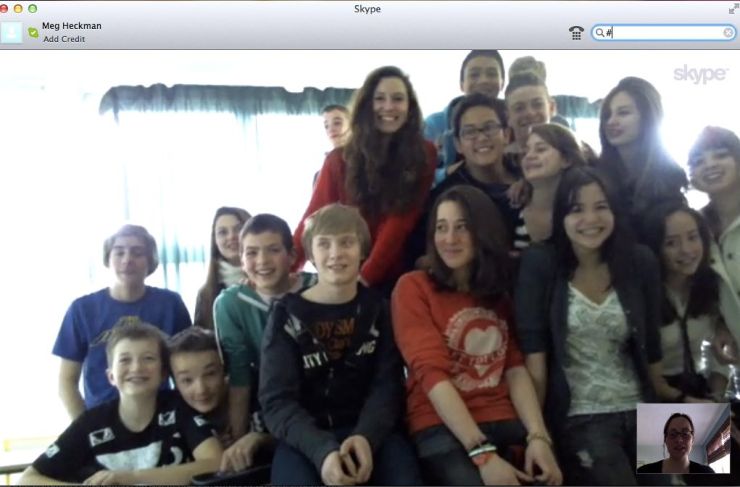 Students at a middle school outside of Paris crowd in front of the camera. Photo/Meg Heckman 